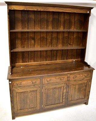 Lot 72 - A reproduction oak Georgian dresser, the base...