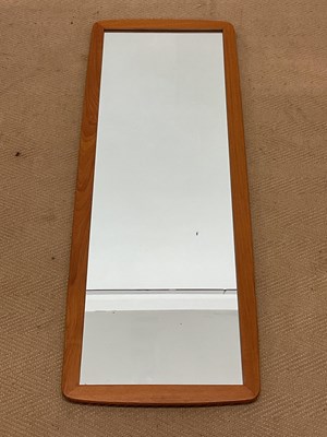 Lot 899 - A 1970s teak framed wall mirror, height 96cm,...