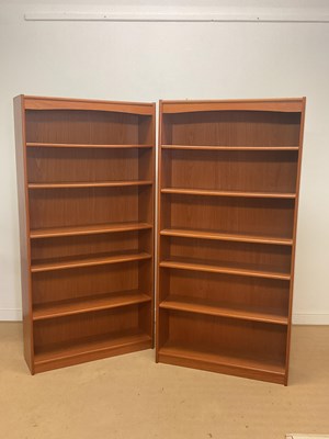 Lot 878 - A pair of mid 20th century teak open bookcases,...