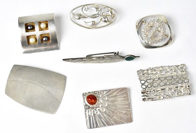 Lot 1228 - Five silver brooches, comprising a square...