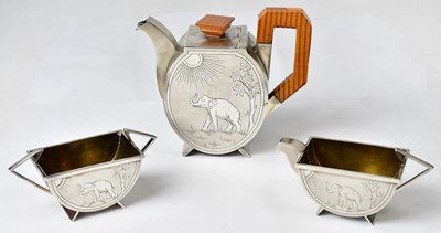 Lot 60 - An Indian Art Deco white metal three-piece...