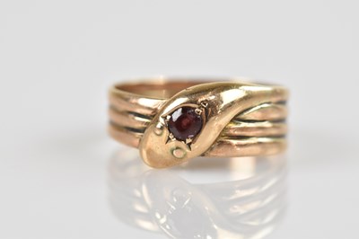 Lot 2573 - A 9ct yellow gold serpent ring, set with a...