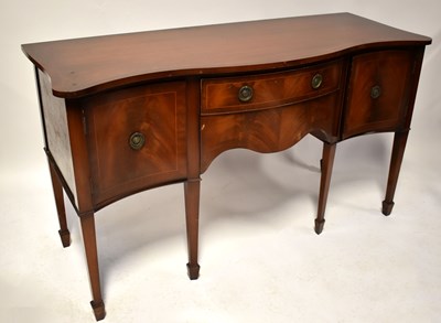 Lot 28 - A Regency-style mahogany bow-fronted sideboard...