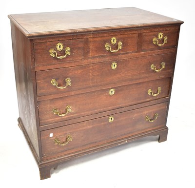 Lot 29 - A George III oak chest of three long and three...