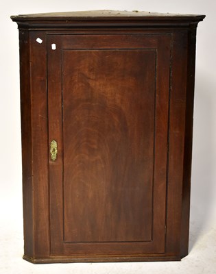 Lot 17 - A 19th century mahogany corner cupboard with...