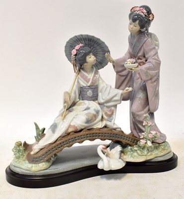 Lot 159 - LLADRÓ; a figure group of geishas on a bridge,...