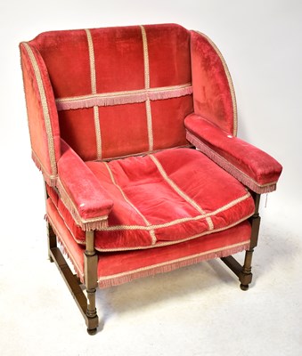 Lot 37 - A Georgian-style wing open armchair...