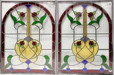Lot 91 - Four large arched floral stained glass panels,...