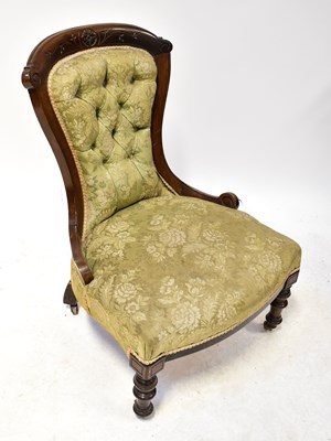 Lot 18 - A Victorian spoon-back nursing chair, button...