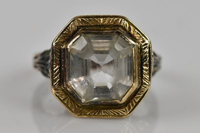 Lot 2390 - A yellow metal dress ring, stamped '9c', set...