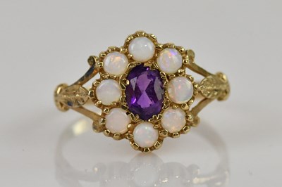 Lot 2461 - A 9ct yellow gold amethyst and opal cluster...
