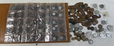 Lot 560 - An album of coins comprising George VI and...