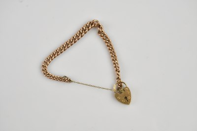 Lot 1134 - A 9ct yellow gold curb link bracelet, with 9ct...