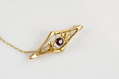 Lot 1346 - An early 20th century yellow metal lozenge...