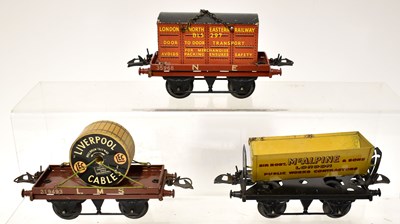 Lot 391 - HORNBY; three boxed O gauge wagons and trucks,...