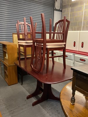 Lot 81 - A folding dining table and four chairs.