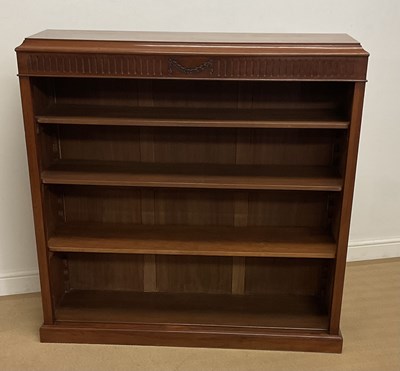 Lot 887 - A walnut open bookcase with three adjustable...