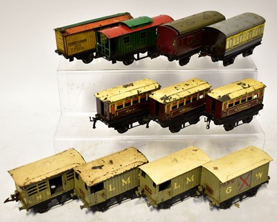 Lot 407 - HORNBY; eleven O gauge tin-plate wagons,...