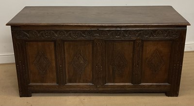 Lot 949 - An oak coffer with four section panelled front,...