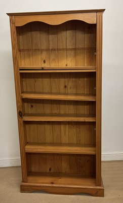 Lot 964 - A pine five shelf open bookcase, height 177cm,...