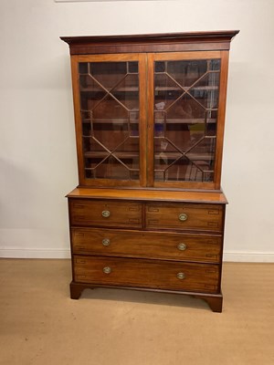 Lot 904 - A mahogany glazed bookcase with two short over...