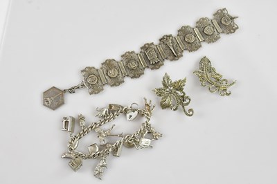 Lot 1075 - A hallmarked silver charm bracelet with...