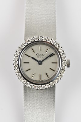 Lot 453 - CHOPARD; a lady's white metal cased wristwatch,...