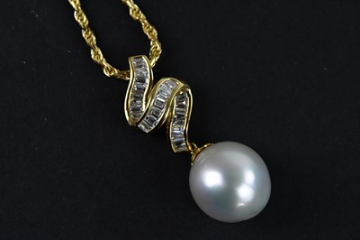 Lot 2005 - A yellow metal diamond and pearl pendant...