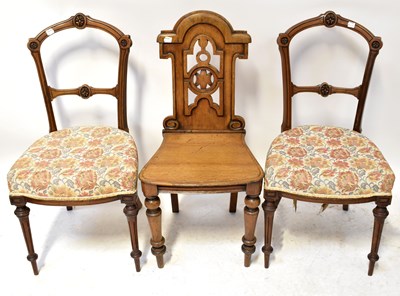 Lot 19 - A 19th century oak hall chair with pierced and...
