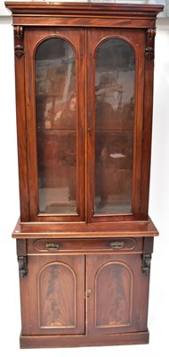 Lot 52 - A Victorian mahogany breakfront bookcase, with...