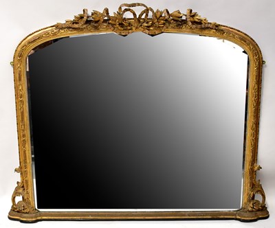 Lot 65 - A gilt framed overmantel mirror, surmounted by...
