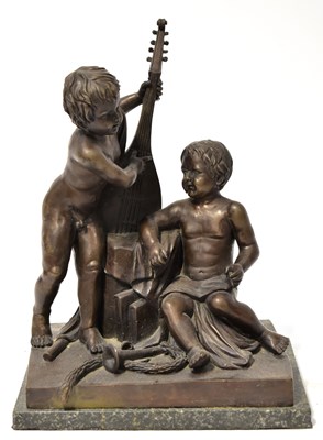 Lot 340 - A bronze figure group of two putti with...