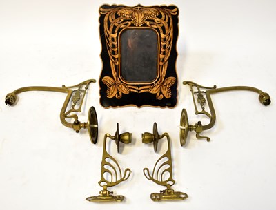 Lot 774 - An Art Nouveau stained and inlaid easel-backed...