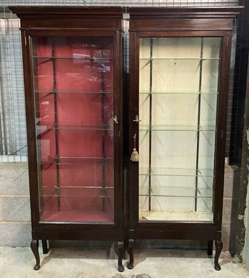 Lot 891 - A pair of glass fronted narrow cabinets, one...