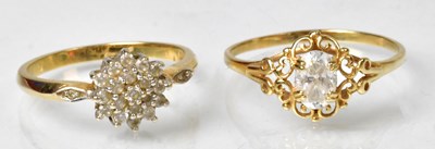 Lot 1157 - Two 14ct gold CZ set rings, each stamped ‘585’,...