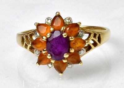 Lot 1187 - A QVC yellow metal, amethyst and gem set ring,...