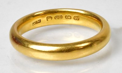 Lot 1127 - A 22ct yellow gold wedding band, size K1/2,...