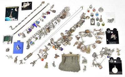 Lot 1215 - Six silver and white metal charm bracelets,...