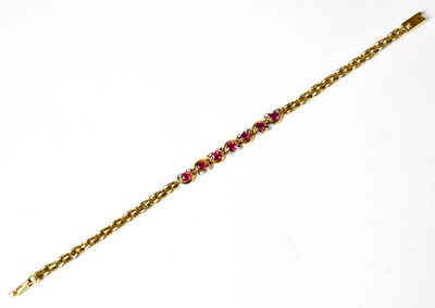 Lot 1210 - A yellow metal diamond and ruby bracelet, set...