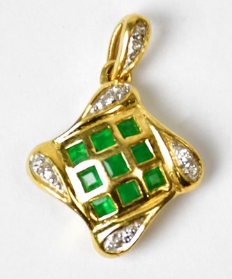 Lot 1265 - A yellow metal pendant set with diamonds and...