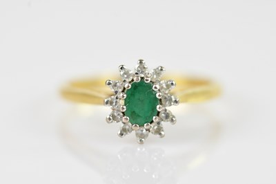 Lot 2486 - An 18ct yellow gold diamond and emerald...