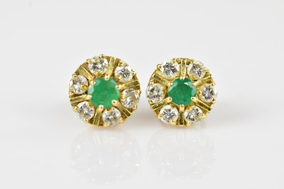 Lot 1370 - A pair of yellow metal diamond and emerald...
