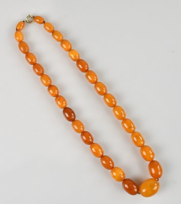 Lot 2086 - A butterscotch amber coloured single strand...