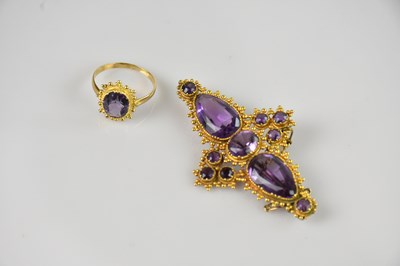 Lot 1273 - A yellow metal amethyst set brooch, set with...