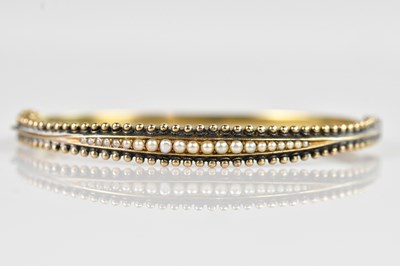 Lot 1176 - A Victorian style yellow metal hinged snap...