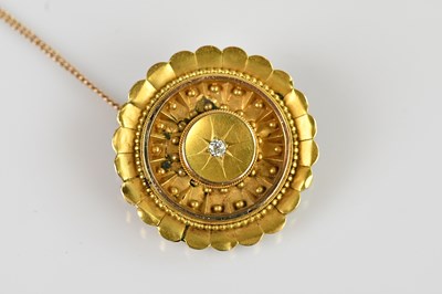 Lot 1310 - A Victorian yellow metal diamond set circular...