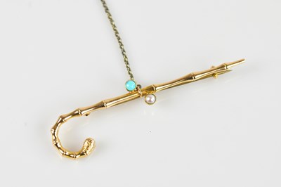 Lot 1312 - A yellow metal novelty bar brooch, set with a...