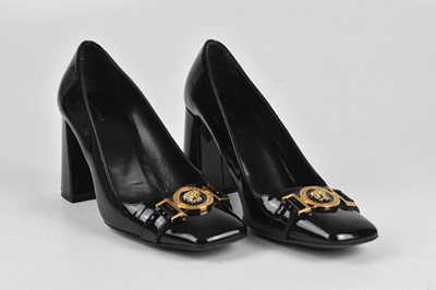 Lot 364 - VERSACE; a pair of black courts and Tommy...
