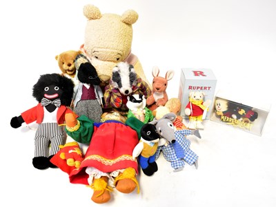 Lot 627 - A collection of soft toys related to...