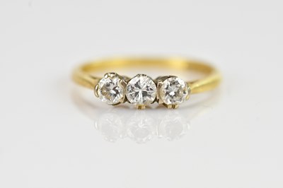 Lot 2323 - An 18ct yellow gold diamond set three stone...